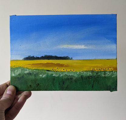 Miniature Sunflowers Landscape #2 oil painting on canvas board in studio, by Jo Earl