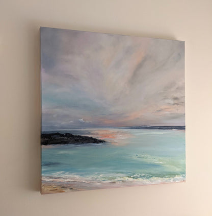 Oil painting of the beach in Redruth, Cornwall hanging on a wall