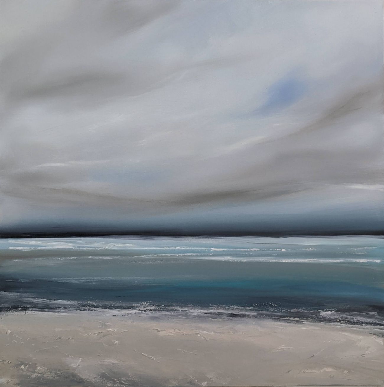 Tranquil Seascape by Jo Earl | oil painting of a cloudy grey sky over a calm greeny-blue sea with a pale sandy shore